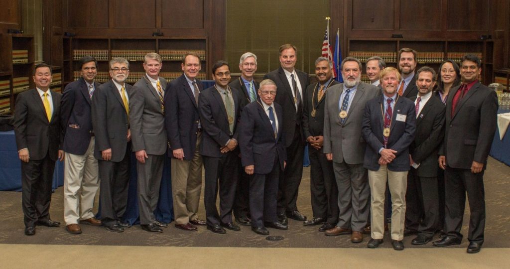 Academy inductees pose with UConn engineering leadership. From left is UConn Provost Mun Choi, electrical and computer engineering Department Head Rajeev Bansal, Dean Kazem Kazerounian, Ken Bowes, John Schneiter, Kartik Chandran, John Augustyn, Andrew Hoffman, William D’Agostino, Manish Gupta, Konstantinos G. Zografos, Christopher Ecsedy, Scott Tyler, Associate Dean for Undergraduate Education and Diversity Daniel Burkey, Senior Associate Dean Michael Accorsi, Associate Dean for Research and Graduate Education Mei Wei, Chemical and biomolecular engineering Department Head Ranjan Srivastava (Photo: Chris LaRosa, UConn School of Engineering)